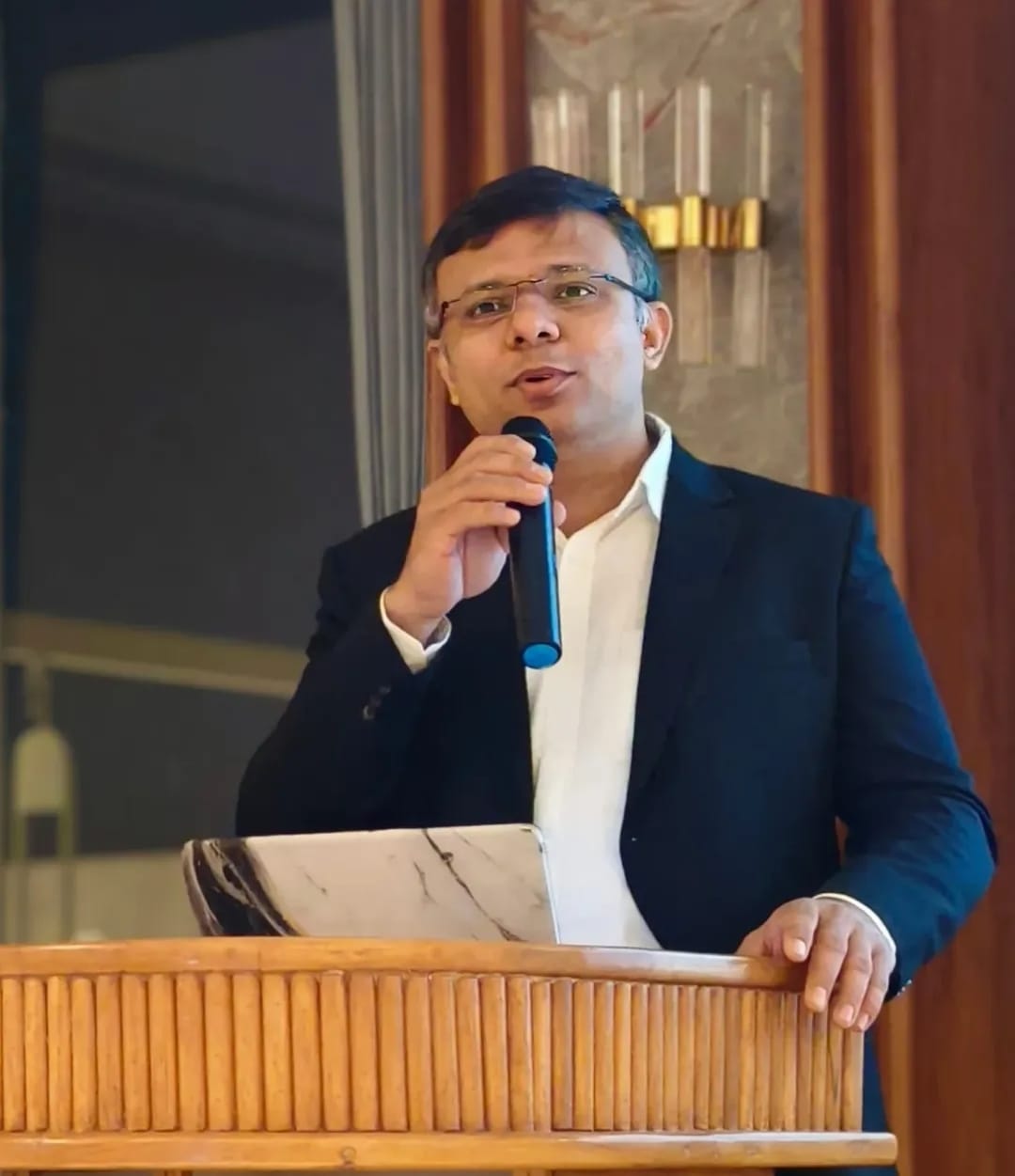 Dr Harsh Raval speaking at a professional event