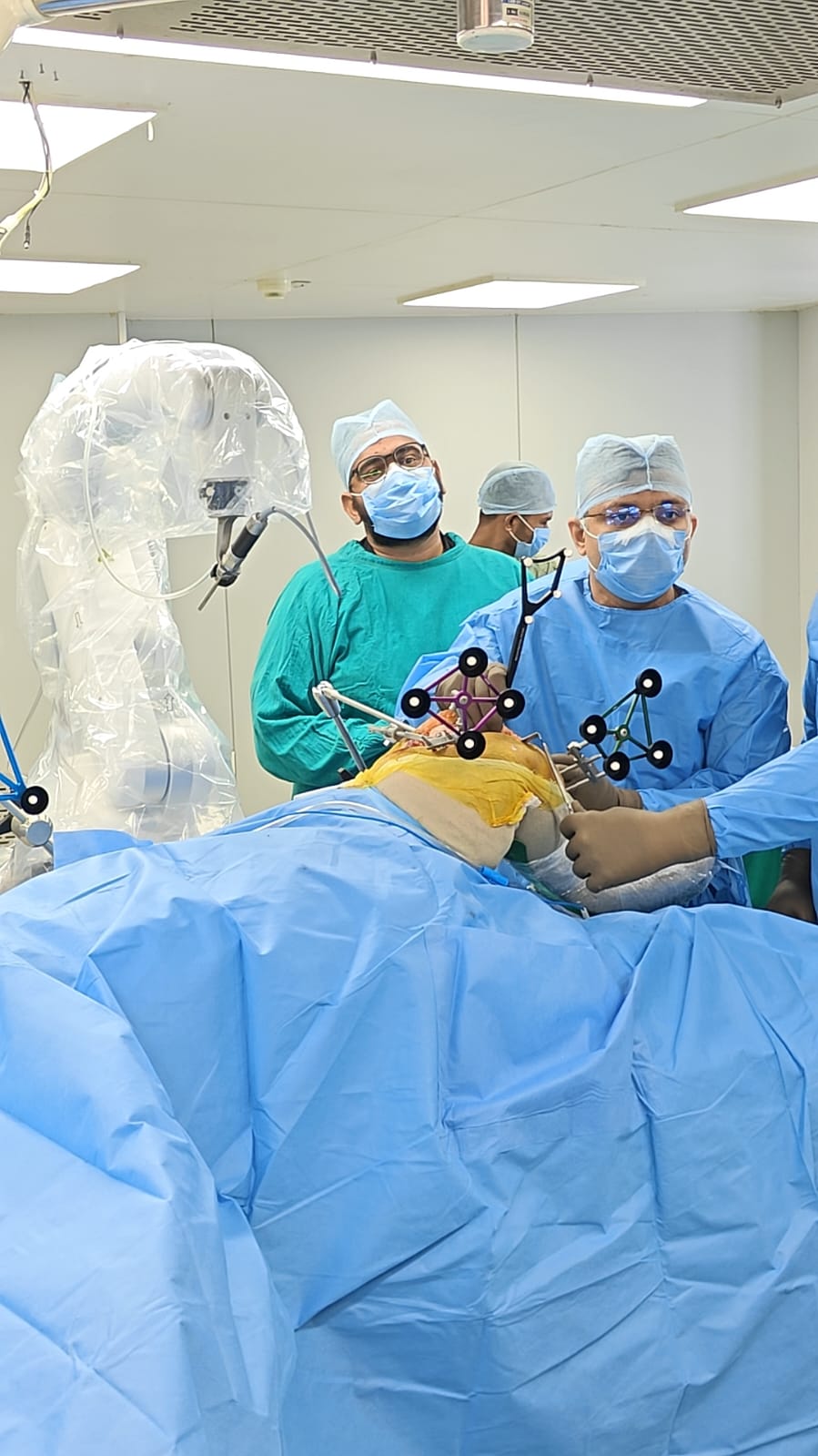Surgical team using guidance equipment during an orthopaedic procedure